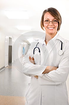 Female doctor in clinic under lamps