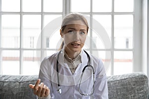 Female doctor consult client online on video call
