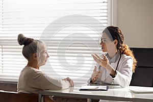 Female doctor consult old woman patient in hospital