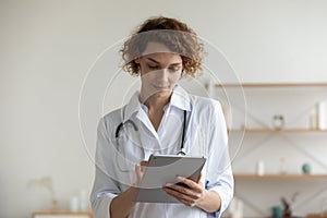 Female doctor consult patient online on tablet