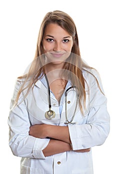 Female doctor with crossed arms smiling at camera