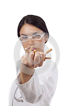 Female doctor crushing cigarettes