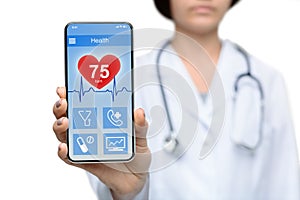 Female doctor demontrating smartphone with health rate information on screen