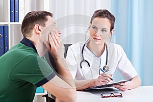 Female doctor diagnosing patient