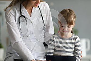 Female doctor exam child patient in hospital