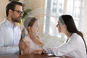 Female doctor examine little child patient at consultation
