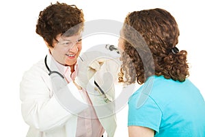 Female Doctor Examines Girl