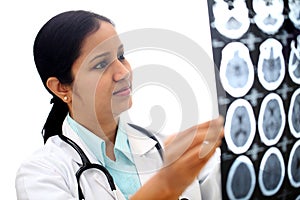 Female doctor examining a brain computerized scan