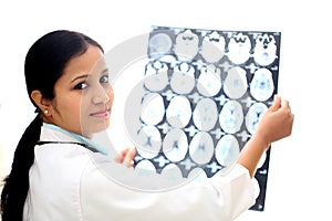 Female doctor examining a brain tomography scan