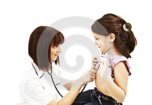 Female doctor examining child with stethoscope