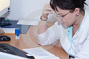 Female doctor examining an x-ray