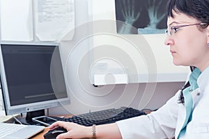 Female doctor examining an x-ray