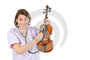 Female doctor examining a violin with stethoscope