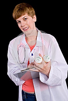 Female doctor filling out prescription orders
