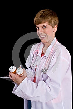 Female doctor filling out prescription orders