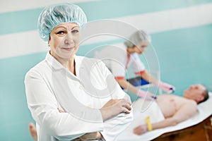 Female doctor in front of cardiogram test