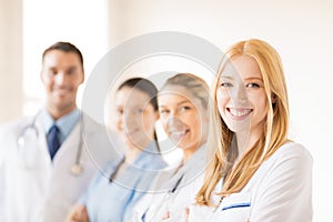 Female doctor in front of medical group