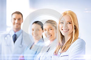 Female doctor in front of medical group