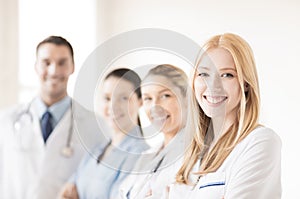 Female doctor in front of medical group