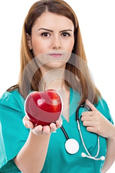 Female doctor giving apple ,concept for healthy lifestyle,