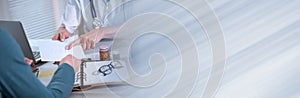 Female doctor giving prescription to her patient; panoramic banner