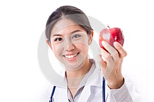 Female doctor with hand holding red apple