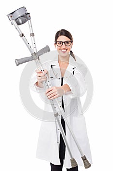 Female doctor handing over crutches