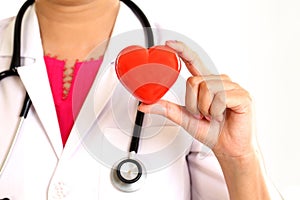 Female doctor hands holding a beautiful red heart shape