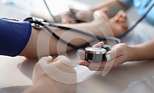 Female doctor hands male patient blood pressure measurement