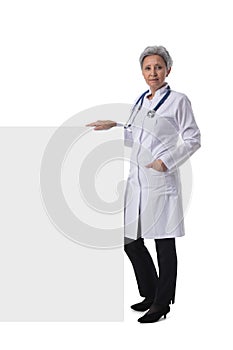 Female doctor holding blank banner