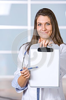 Female doctor holding blank chart
