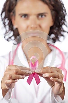 Female doctor holding breast cancer ribbon