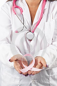 Female doctor holding breast cancer ribbon