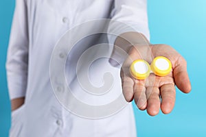 Female doctor holding contact lens case