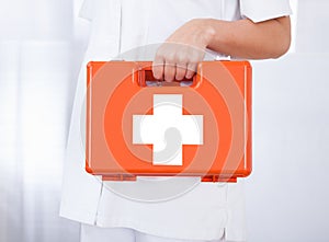 Female Doctor Holding First Aid Box