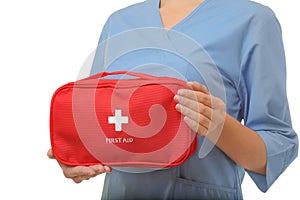 Female doctor holding first aid kit on white background, closeup.