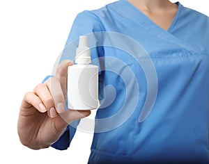 Female doctor holding plastic bottle with medicament on white background, closeup.