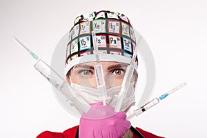 Female doctor holding several syringes in front of face