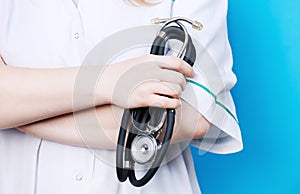 Female doctor holding stethoscope