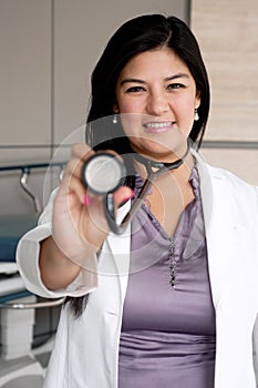 Female Doctor holding stethoscope