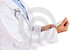 Female doctor holding thermometer with stethoscope.