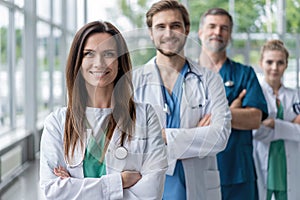 Female doctor at the hospital with her team.