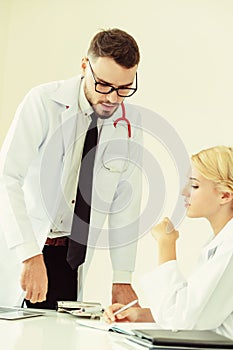 Female doctor at hospital talking to her partner.