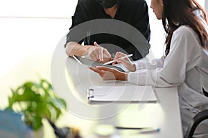 A female doctor inquires about a male patient`s medical history