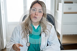 Female doctor interacting with patient in online video call. Screen point of view