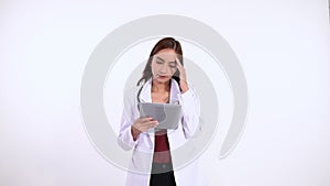 female doctor in long hair confuse while using tablet