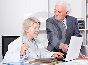 Female doctor with male client
