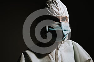 Female doctor with mask and medical protective suit