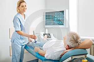 Nice delighted woman looking at her patient