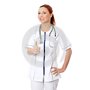 Female doctor or nurse gesturing ok